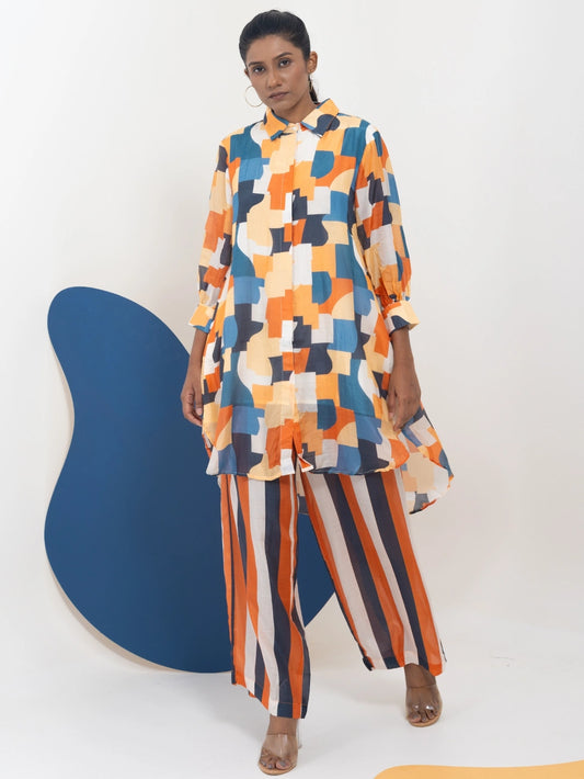 Woman in a colorful patterned outfit