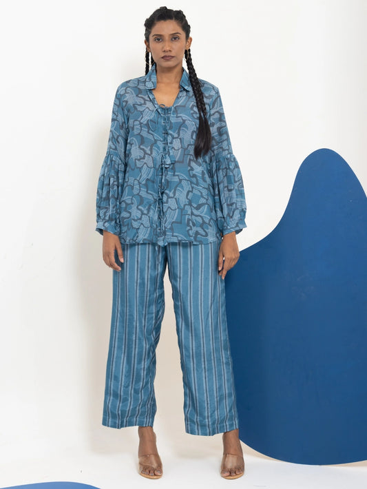 Woman wearing a blue patterned outfit