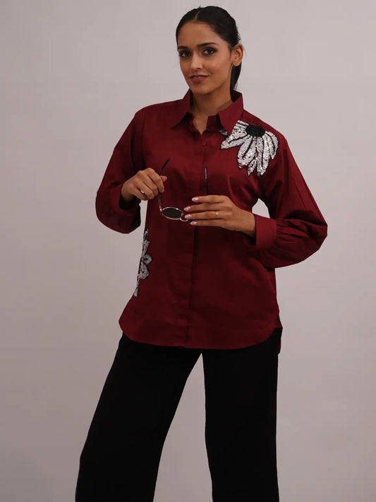Woman maroon shirt with floral embroidery