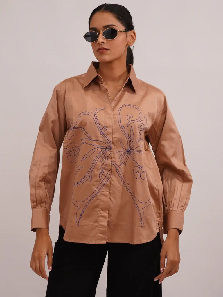 Woman wearing a beige shirt 