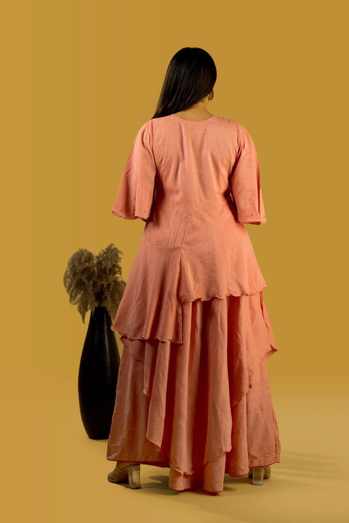 Woman wearing a peach-colored dress