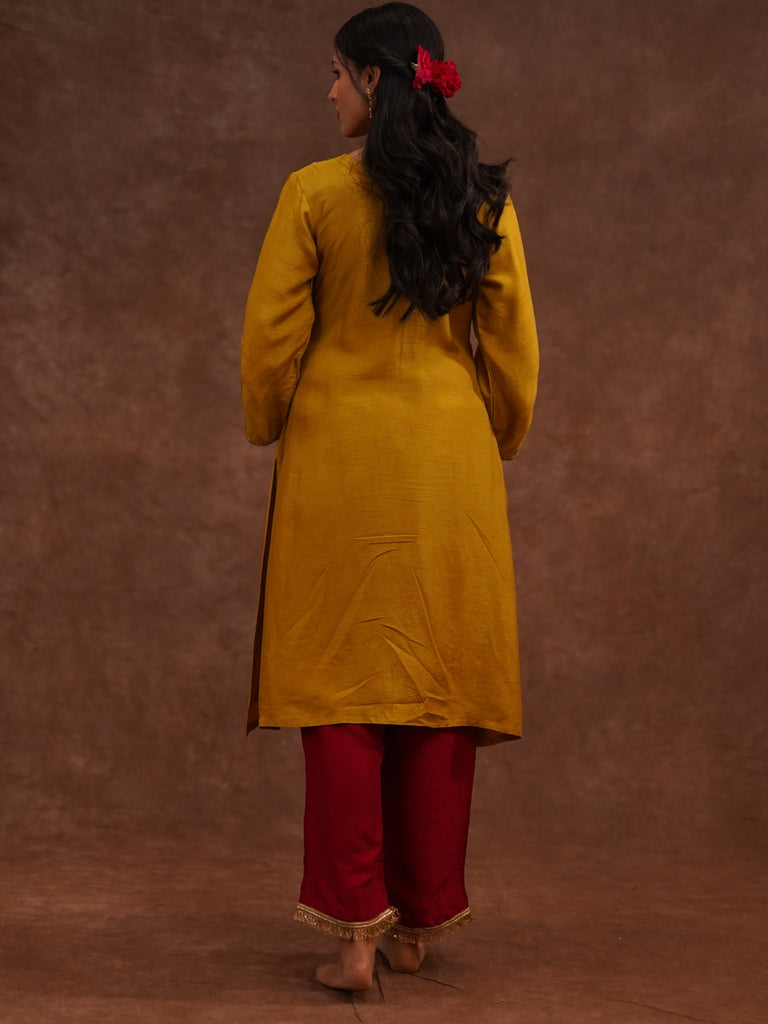Person wearing a yellow kurta 