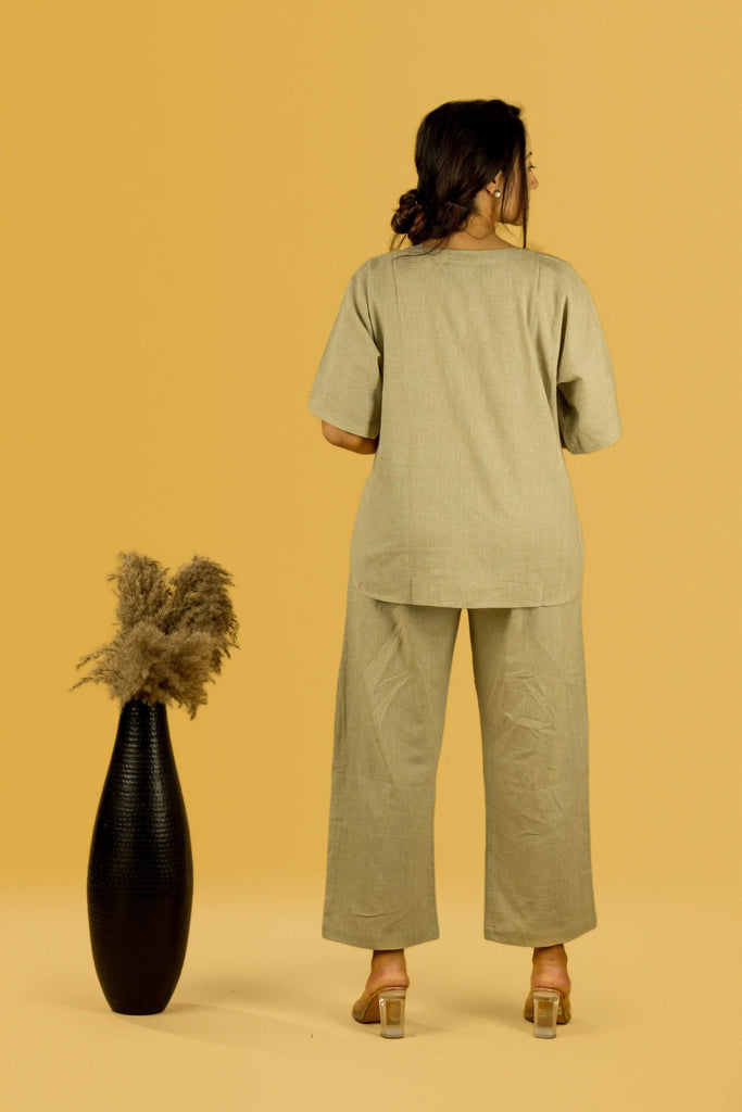 Woman wearing a beige outfit 