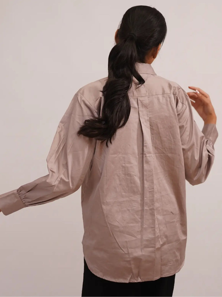 Person wearing a beige shirt  outfit woman 