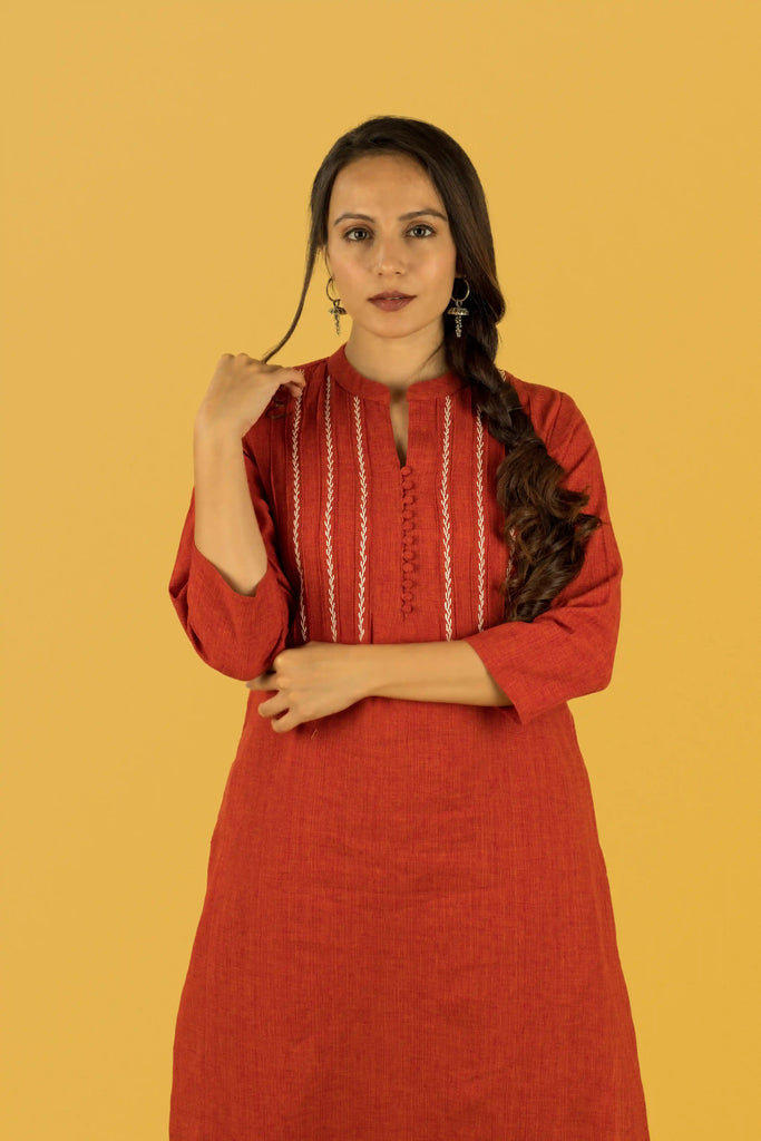 red traditional outfit with white patterns for women 